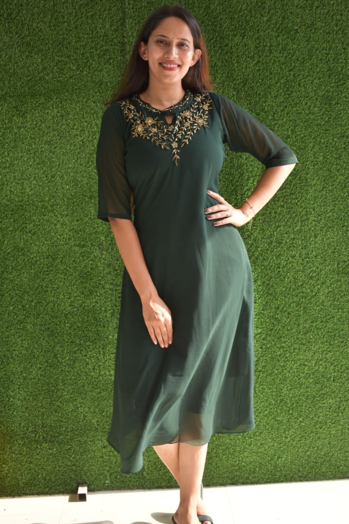1. A Jewel neck kurthis